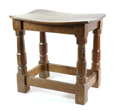 Lot 567 - Mouseman: A Robert Thompson Oak Dish Top Stool, on four octagonal legs joined by stretchers,...