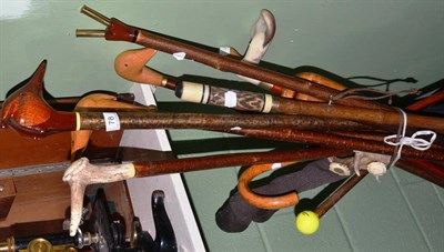 Lot 78 - A handmade collection of fourteen walking sticks and four crops together with an umbrella (19)