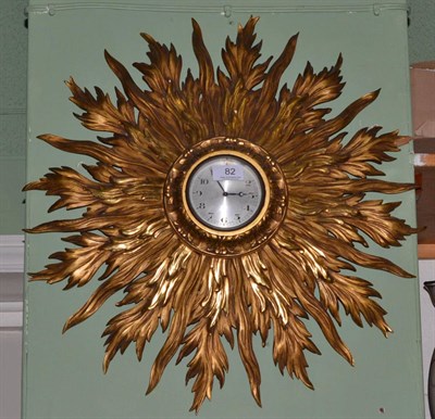 Lot 82 - A star burst giltwood wall clock