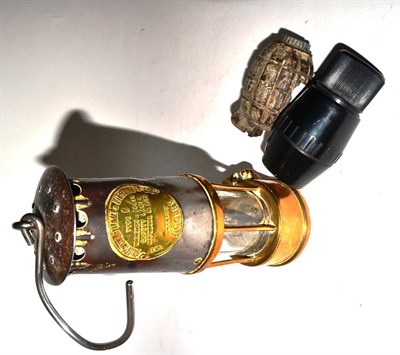 Lot 85 - An Eccles miners' safety lamp and two deactivated hand grenades