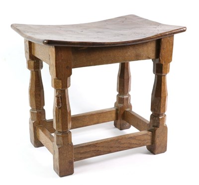 Lot 569 - Mouseman: A Robert Thompson Oak Dish Top Stool, on four octagonal legs joined by stretchers,...