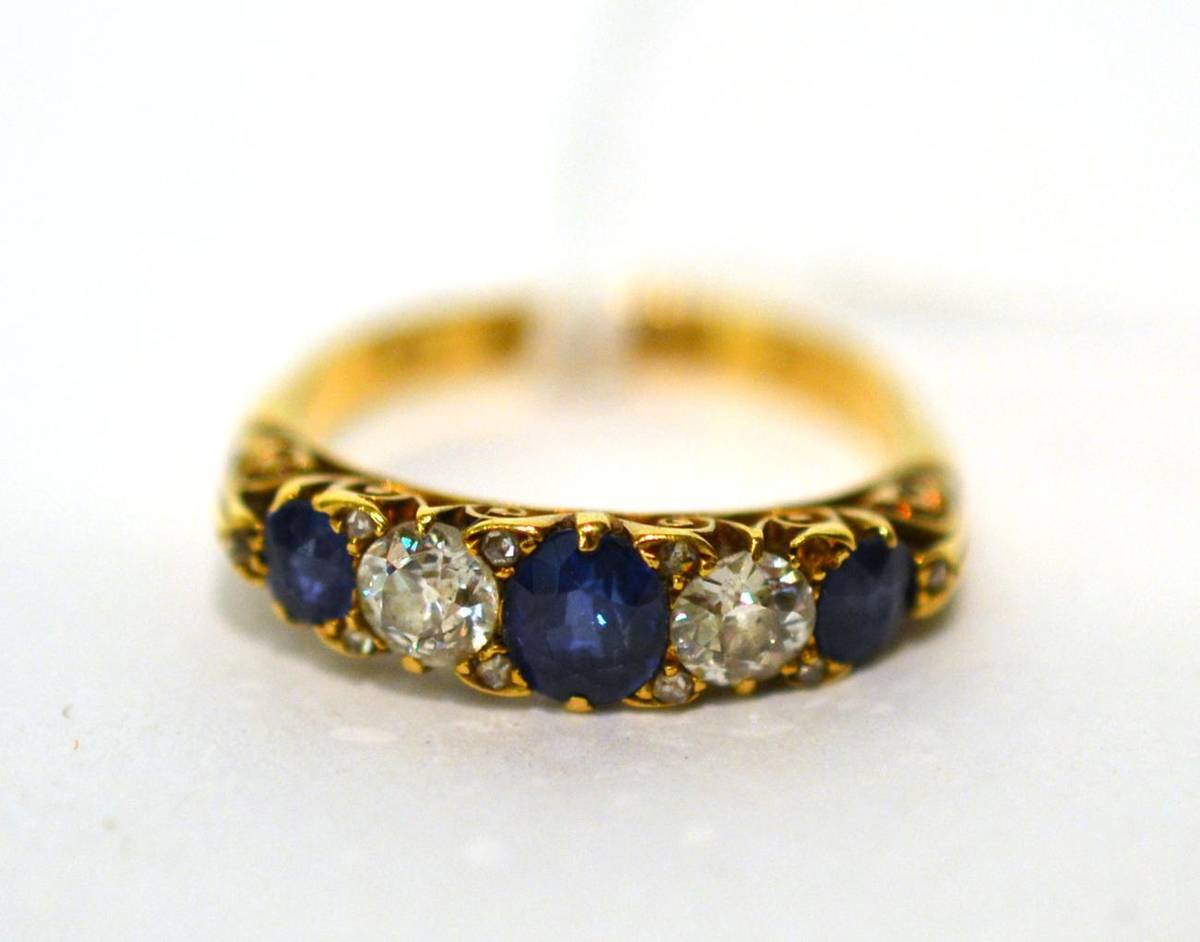 Lot 104 - An 18ct gold sapphire and diamond ring