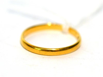 Lot 127 - A 22ct gold band ring (acid test 14ct)