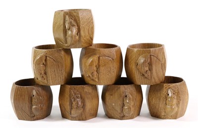 Lot 574 - Mouseman: Eight Robert Thompson English Oak Napkin Rings, of octagonal form, each with carved mouse