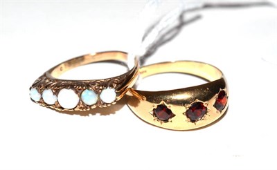 Lot 150 - A 9ct gold garnet ring and an opal ring (2)