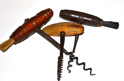 Lot 158 - Three Victorian corkscrews; one horn handled and two with integral brushes (3)