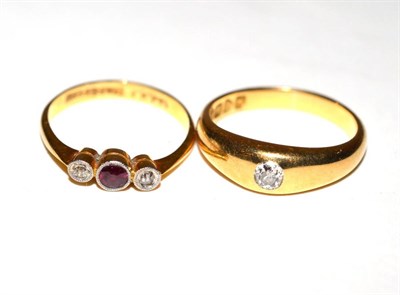 Lot 167 - An 18ct gold ring gypsy set with a single stone together with an 18ct gold three stone ring (2)