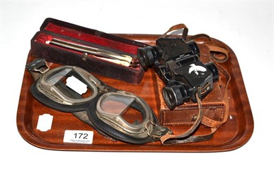 Lot 172 - A pair of flying glasses, Negretti & Zambra cased binoculars and two cased cut throat razors