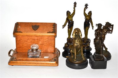 Lot 184 - An oak stationery inkwell box, pair of spelter figures and three modern bronzed figures of a...