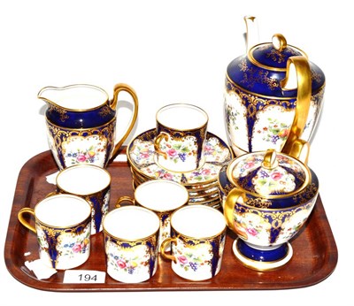 Lot 194 - An Aynsley coffee set, decorated with fruit design on cobalt blue and gilt embellished ground (qty)