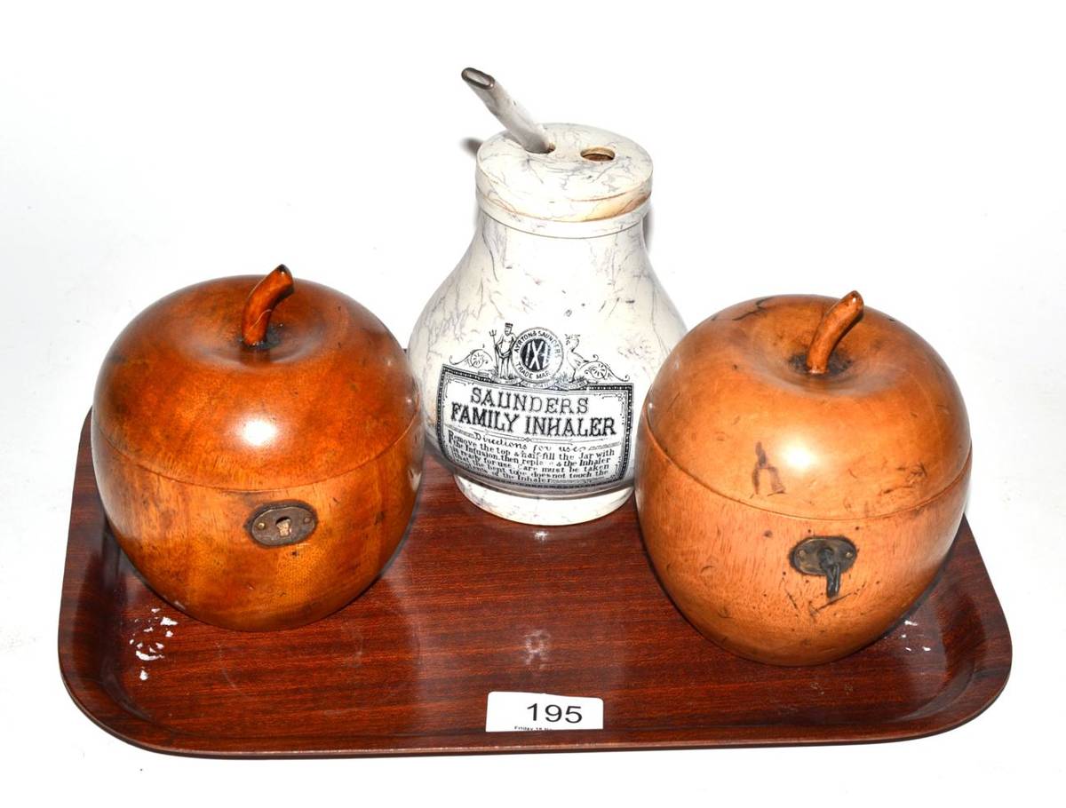 Lot 195 - Two apple tea caddies and a marbled pottery Saunders family inhaler