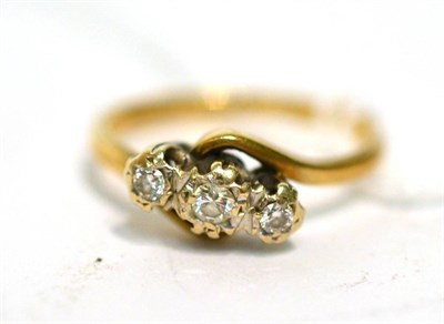 Lot 219 - A three stone diamond ring
