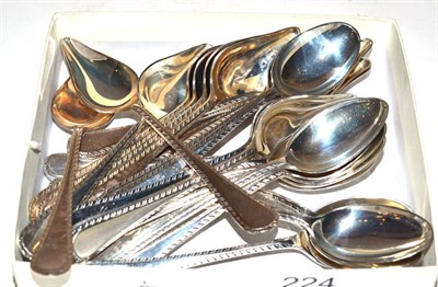 Lot 224 - A set of twelve silver teaspoons and grapefruit spoons, with feather edges, James Dixon & Sons,...