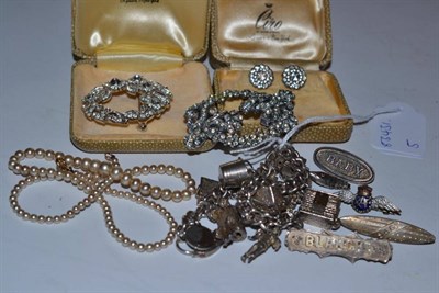 Lot 235 - A charm bracelet, Victorian brooches, a simulated pearl necklace and paste set jewellery