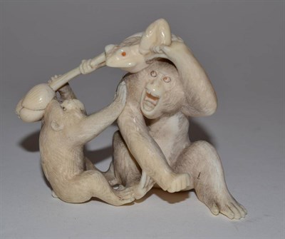 Lot 237 - A Meiji period carved ivory netsuke of two monkeys and a frog