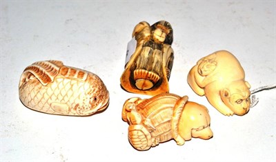 Lot 251 - Four Meiji period ivory netuskes including monkey, fish, etc