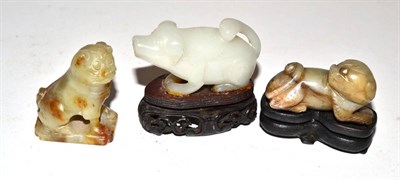 Lot 252 - Three Oriental carved green hardstone models of animals