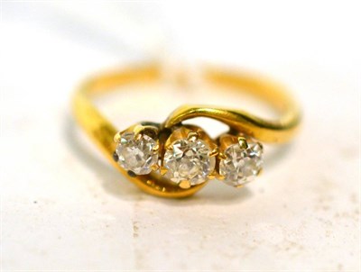 Lot 254 - A gold and diamond three stone ring