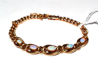 Lot 261 - An opal bracelet, stamped '15ct'