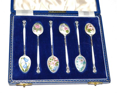 Lot 279 - A cased set of six silver enamel teaspoons decorated with floral sprays