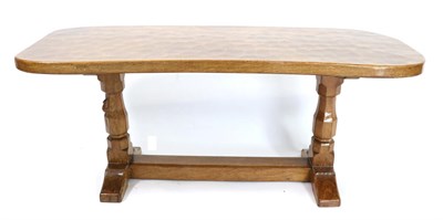 Lot 593 - Mouseman: A Robert Thompson Oak Kidney Shaped Coffee Table, on two octagonal legs, joined by a...