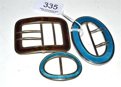 Lot 335 - Two silver blue guilloche enamel buckles by Lawrence Emanuel and another guilloche enamel...