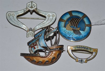 Lot 350 - An enamel brooch by Hjaltasteyn Ltd and three other enamel brooches (4)