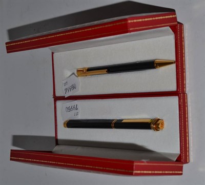 Lot 356 - Two cased Must de Cartier ballpoint pens