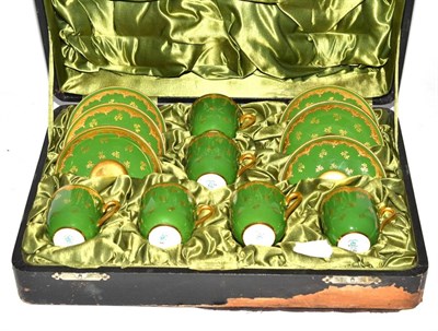 Lot 368 - A cased Coalport coffee service with gilt decoration on a green ground, pattern number 4566