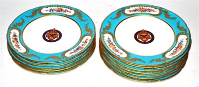 Lot 378 - Twelve 19th century Minton plates decorated with floral borders and a crest to the main well