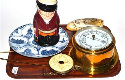 Lot 380 - An aneroid barometer, a faux scrimshaw tooth made of resin, a Royal Doulton character jug The...