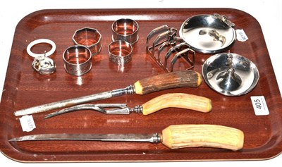 Lot 405 - A three piece antler handled carving set, four division silver toast rack, four silver napkin...
