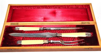 Lot 410 - A cased three piece silver mounted carving set