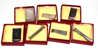 Lot 417 - A collection of Austrian silver items of vertu: four money clips, two scent sprays and an aide...