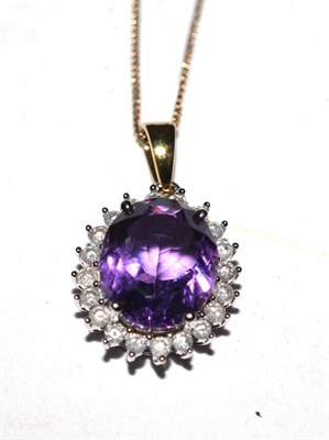 Lot 426 - An amethyst and diamond pendant, the clasp and suspension loop stamped '375'