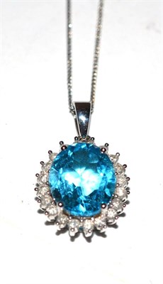 Lot 428 - A blue topaz and diamond pendant, with an 18ct gold suspension loop, the clasp stamped '375'