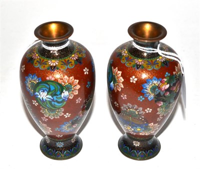 Lot 434 - A pair of cloisonne vases, decorated with flowers and butterflies, 13cm high