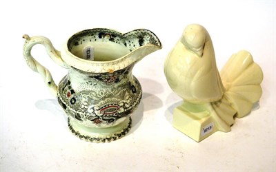 Lot 437 - An Art Deco blanc de chine dove, together with a Victorian transfer printed jug (2)