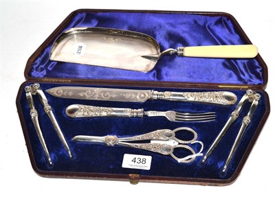 Lot 438 - A group of cased silver plated items including nutcrackers, grape scissors, etc together with a...