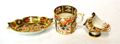 Lot 440 - A Royal Crown Derby Imari palette oval dish, miniature coal helmet and a coffee can (3)