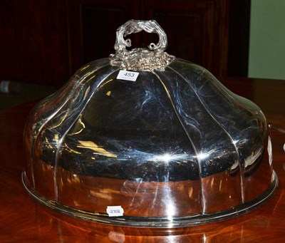 Lot 453 - A large silver plated food dome with elaborate handle