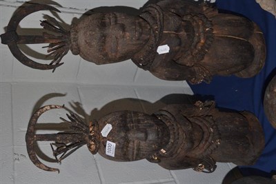 Lot 1000 - A pair of Togo female fetish figures each wearing a headdress of sickle and various blades with...