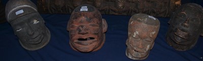 Lot 1007 - Four Makonde Lipiko helmet masks, Tanzania