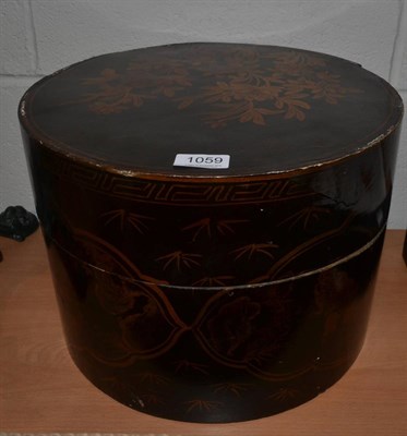 Lot 1059 - A Japanned hat box and a top hat