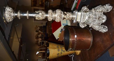 Lot 1083 - A copper log bin, a reproduction toleware umbrella stand and a silvered torchere (3)