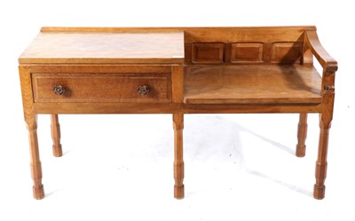 Lot 615 - Foxman: A Don Craven (Aldborough, near Boroughbridge) English Oak Telephone Seat, with a raised...