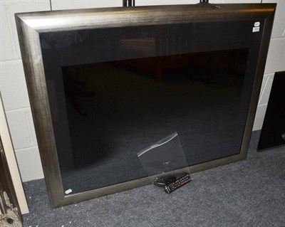 Lot 1143 - A Samsung flatscreen internet TV in silvered frame with bracket