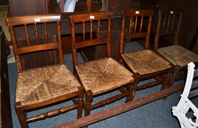 Lot 1148 - A set of four rush seated chairs