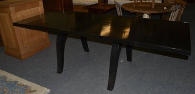 Lot 1152 - A 1930's ebonised French extending dining table