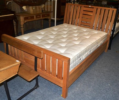 Lot 1163 - A modern oak framed double bed with a new Airsprung mattress